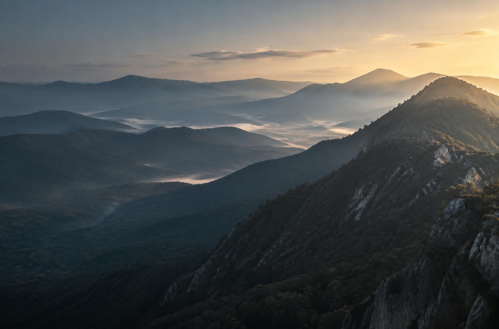 Layered mountain ridges at dawn